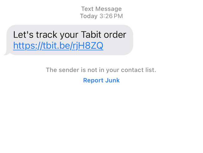 An iPhone text message from Tabit with a link to click. 
