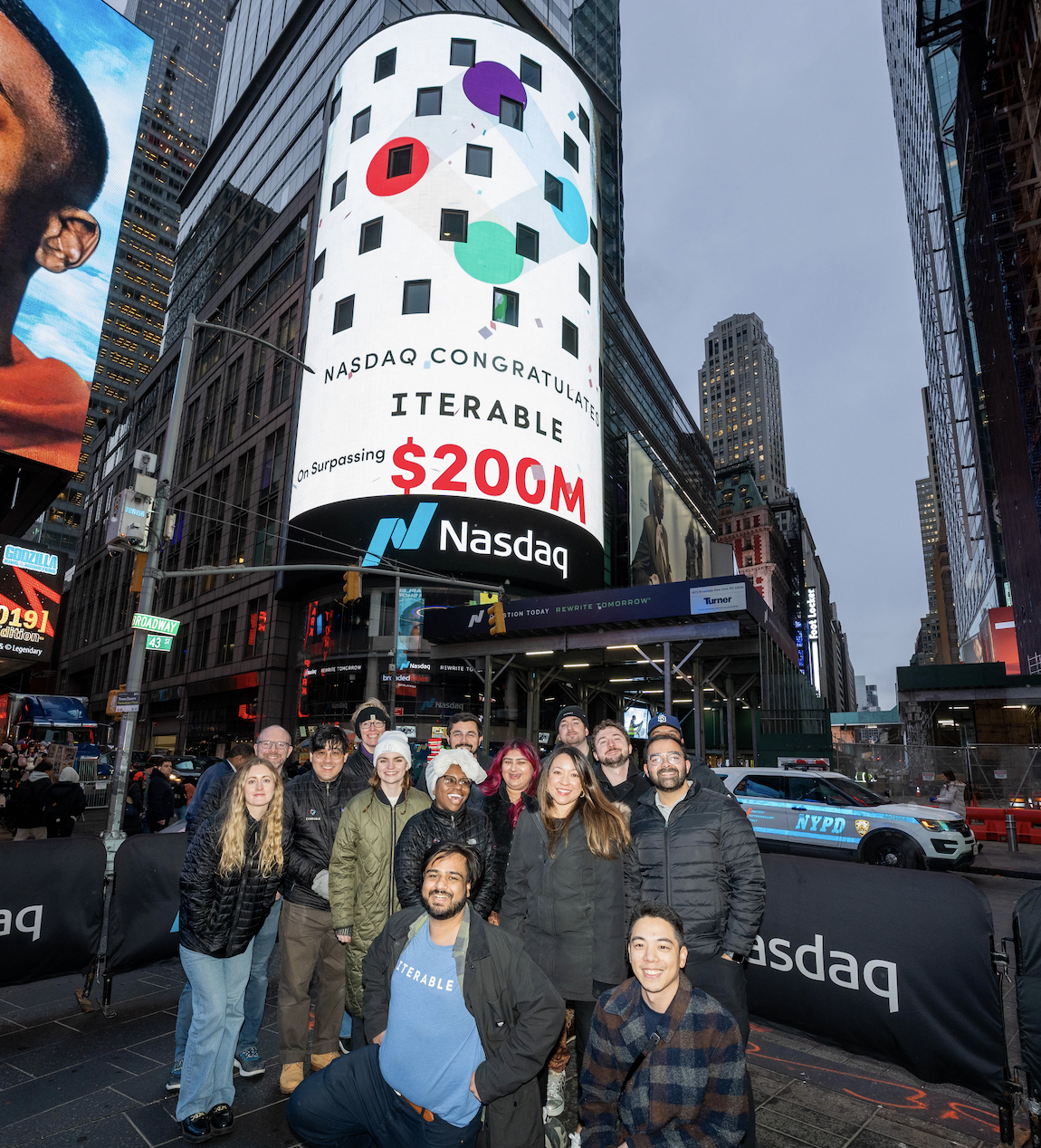 Photo outside the NASDAQ Tower which is displaying the Iterable logo and "$200m ARR."